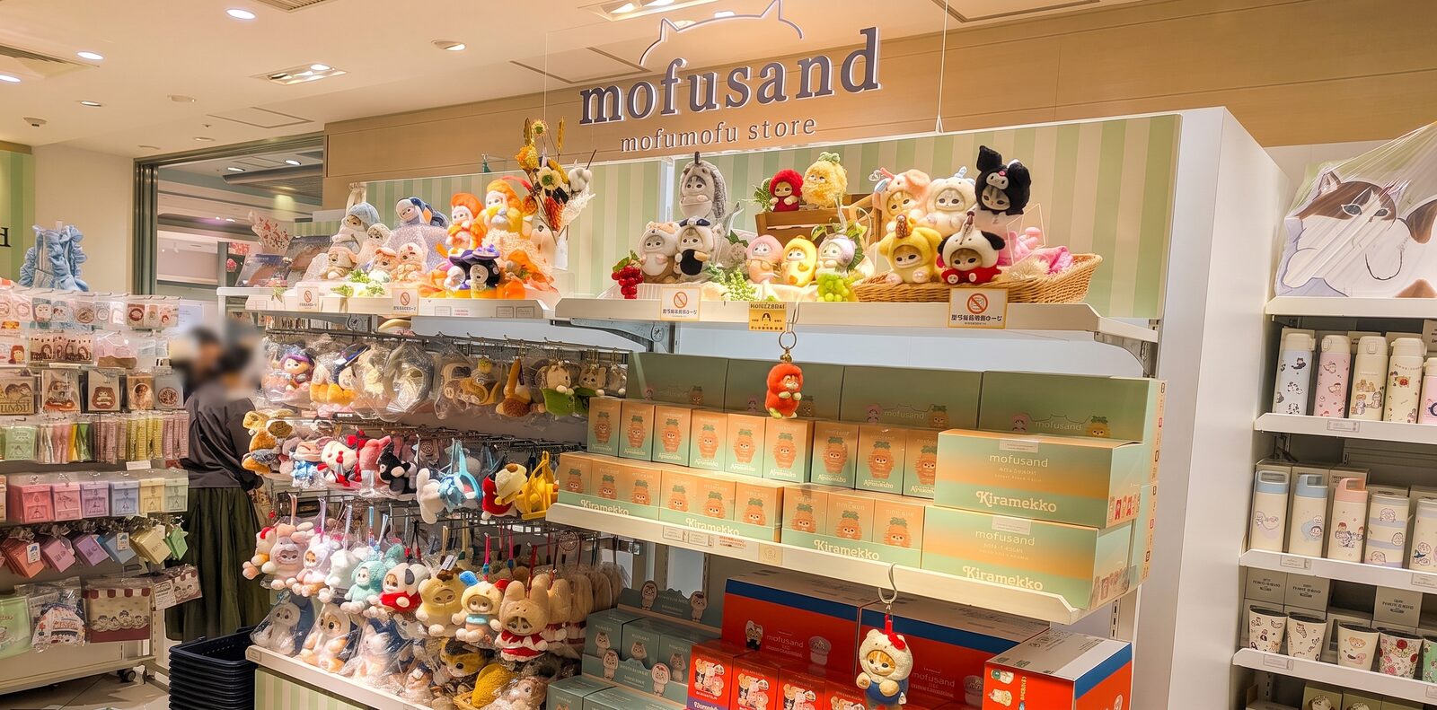 mofusand Mofumofu Store Sign above Plush Cats and Kiramekko Sweets Goods